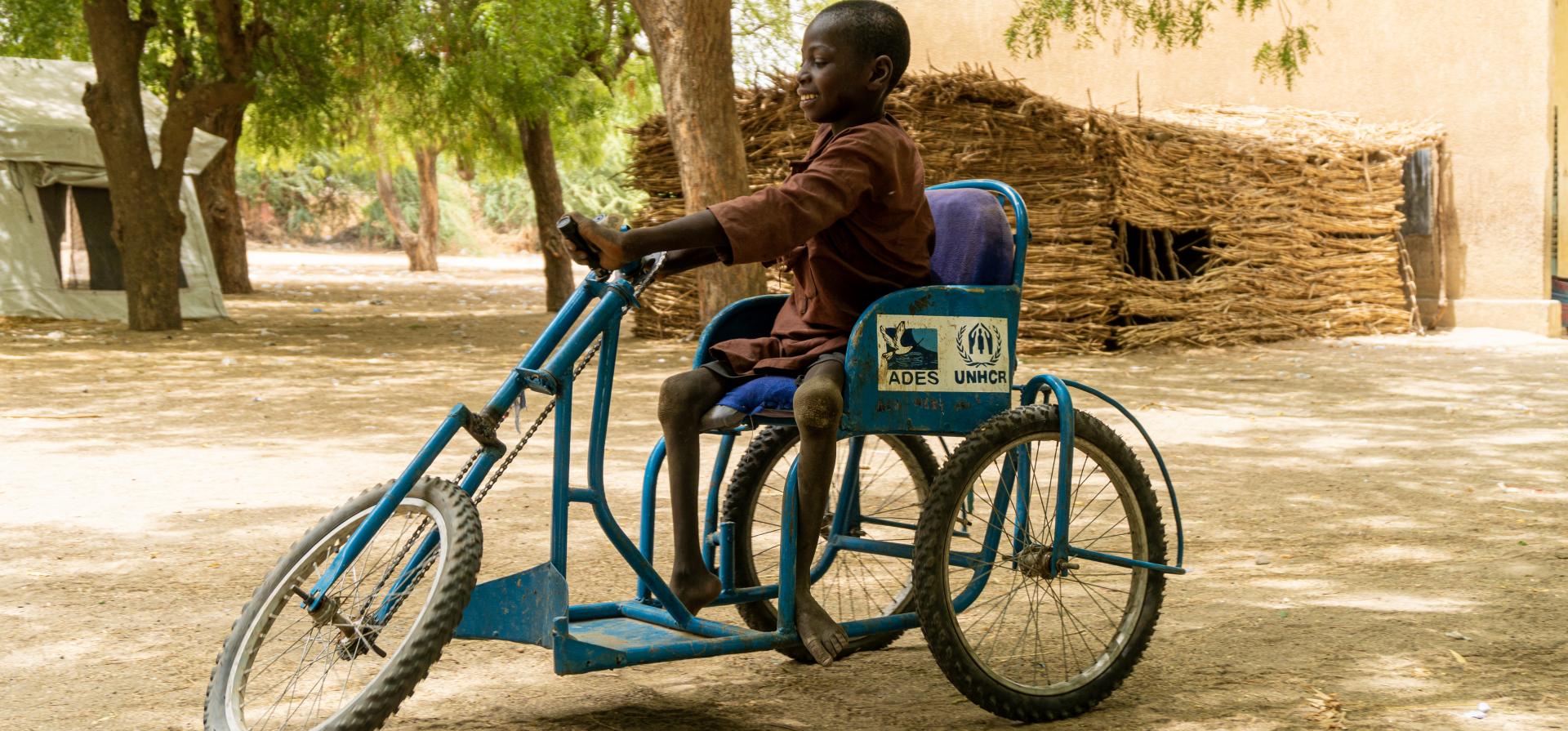 kid with disabilities on his bike