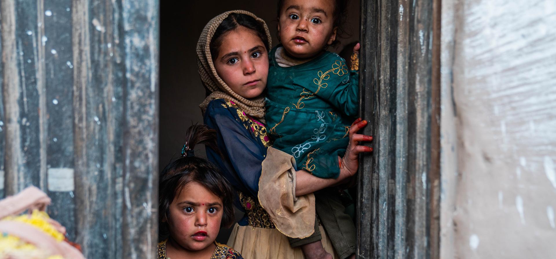 children looking from a window