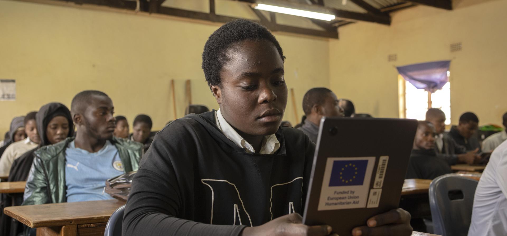 teenager studying with tablet